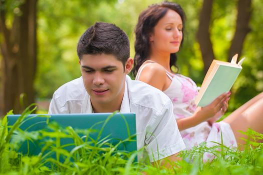 couple resting on nature