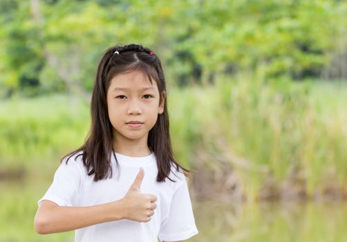 Outdoors portrait of beautiful Asian young girl