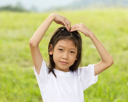 Outdoors portrait of beautiful Asian young girl