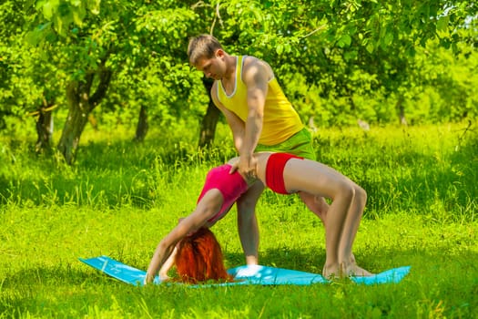 men helping  female stretching muscles