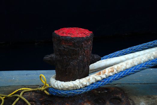 stock picture of ship ropes and structures to mooring the ship on the dock