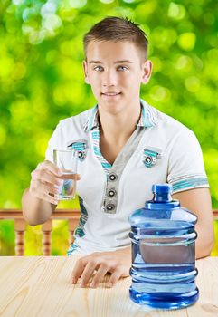 a guy with glass of water