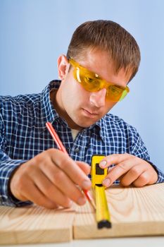 man with red pencil