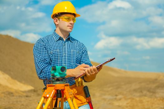 a contractor writing in clipboard