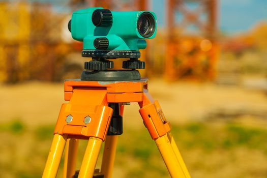 close up view on old theodolite on construction place