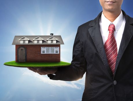 business man and new home on green field