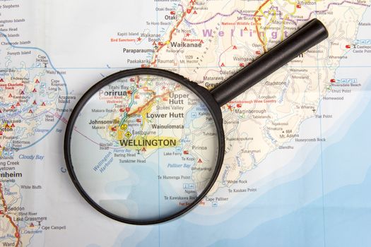 Magnifying glass on map highlighting Wellington in New Zealand