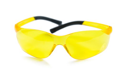 isolated yellow safety glasses
