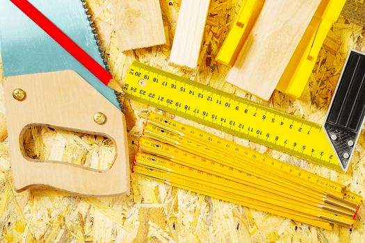 set of construction tools on plywood