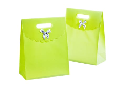 two green paperbags isolated on white