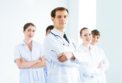 team of experienced highly qualified doctors, fold one's arms