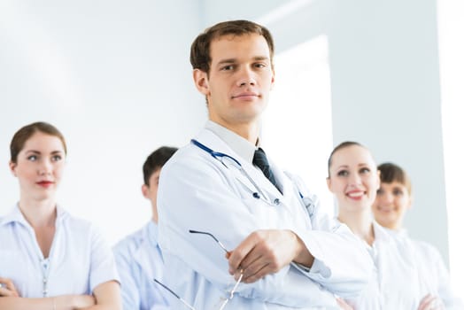 team of experienced highly qualified doctors, fold one's arms