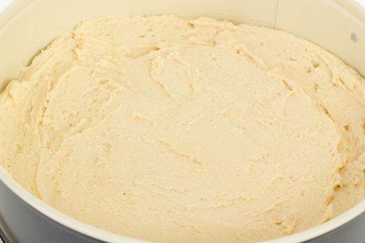 Springform pan filled with cake dough
