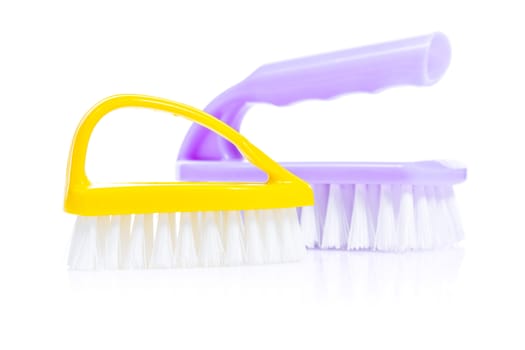 yellow and purple kitchen brushes