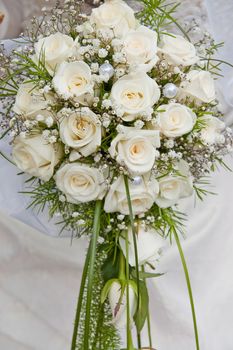white fine rose in wedding bouquet