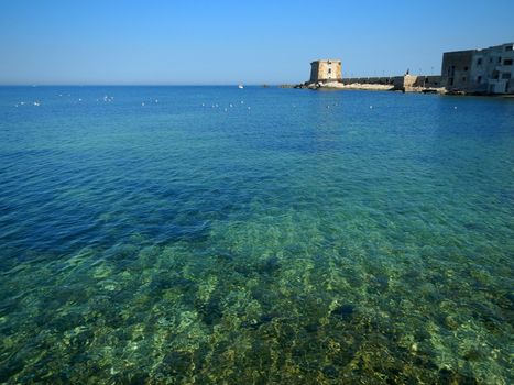 A landscape with the colors of the sea of Trapani.