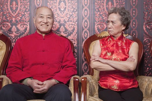 Angry Grandmother and Happy Grandfather in Traditional Chinese Clothing