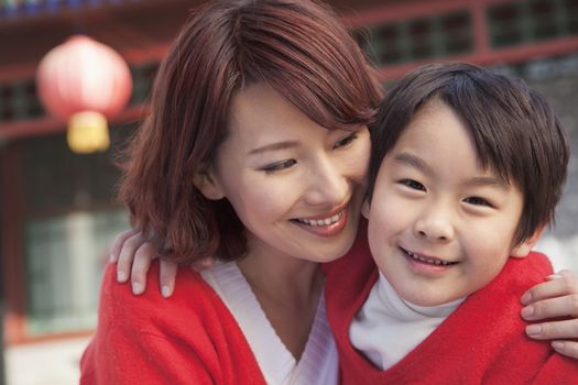 Mother and Son in Traditional Courtyard