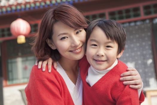 Mother and Son in Traditional Courtyard