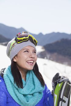 Young Woman Carrying Her Skis