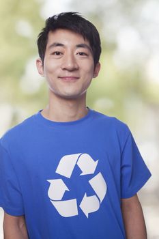 Portrait of young man with recycling t-shirt