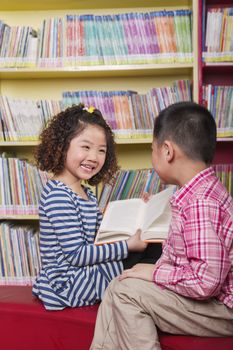 Boy and Girl Reading Together