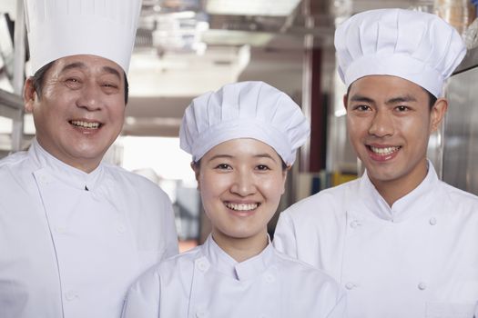 Three Chefs in an Industrial Kitchen