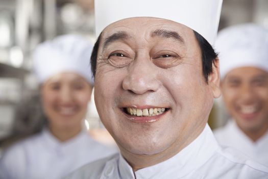 Portrait of a Chef in an Industrial Kitchen