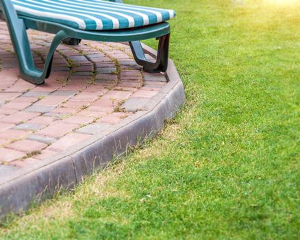 Beautiful park garden in summer and a path of stones