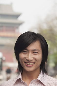 Young Man smiling looking at camera