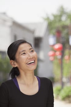 Young Woman smiling and looking Away