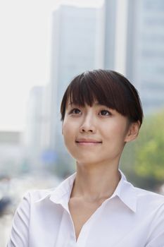 Portrait of young businesswoman smiling, Beijing