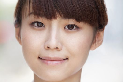 Close-up portrait of young woman smiling in Beijing