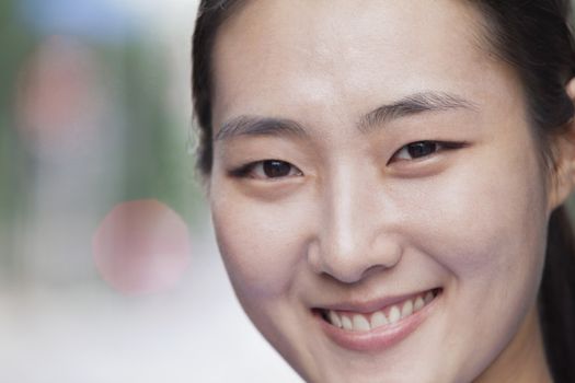 Portrait of young businesswoman smiling in Beijing