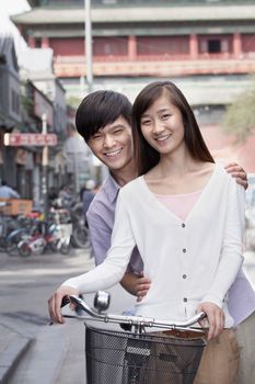 Young Heterosexual Couple on a Bicycle in Beijing