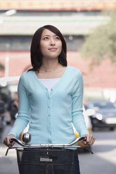 Young Woman on a Bicycle in Beijing