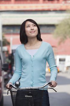 Young Woman on a Bicycle in Beijing