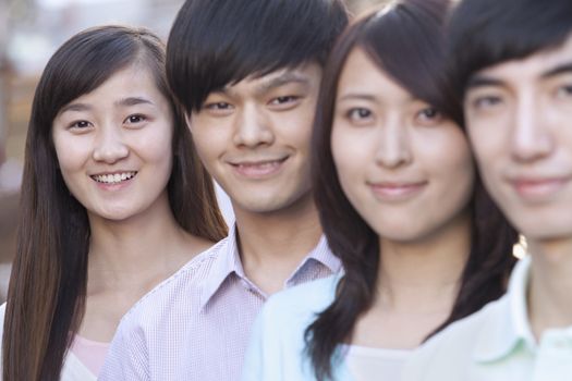 Four Young People Standing in a Row in Beijing