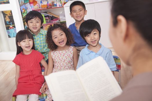 Teacher Reading to Her Students