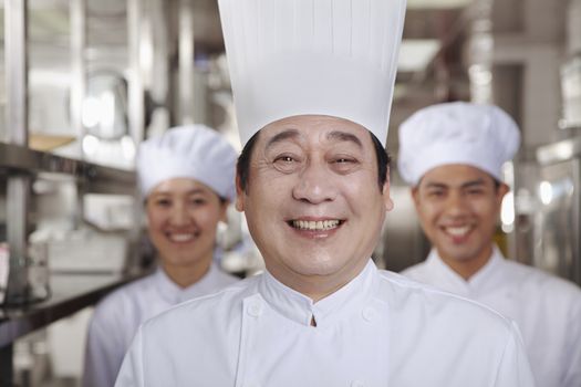 Three Chefs in an Industrial Kitchen