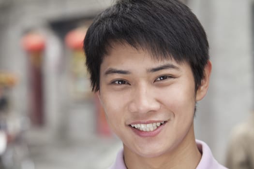 Young Man smiling and looking at camera