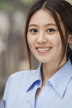 Young Woman smiling and looking at camera