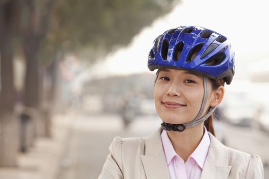 Young Business Woman commuting with a Bicycle, Beijing, China