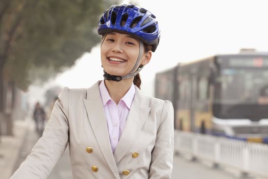 Young Business Woman commuting with a Bicycle, Beijing, China