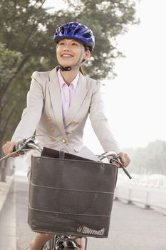 Young Business Woman commuting with a Bicycle, Beijing, China