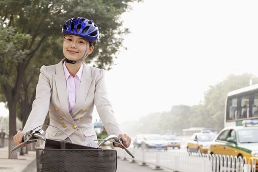 Young Business Woman commuting with a Bicycle, Beijing, China