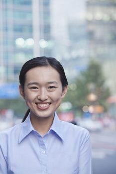 Portrait of young businesswoman smiling in Beijing