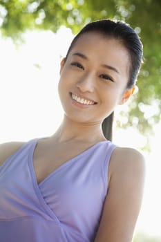 Portrait of Young Woman In Park