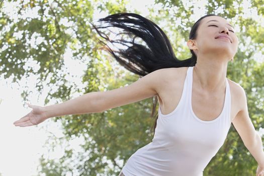 Relaxed Young Woman in Park