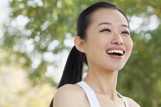 Portrait of Young Woman in Park